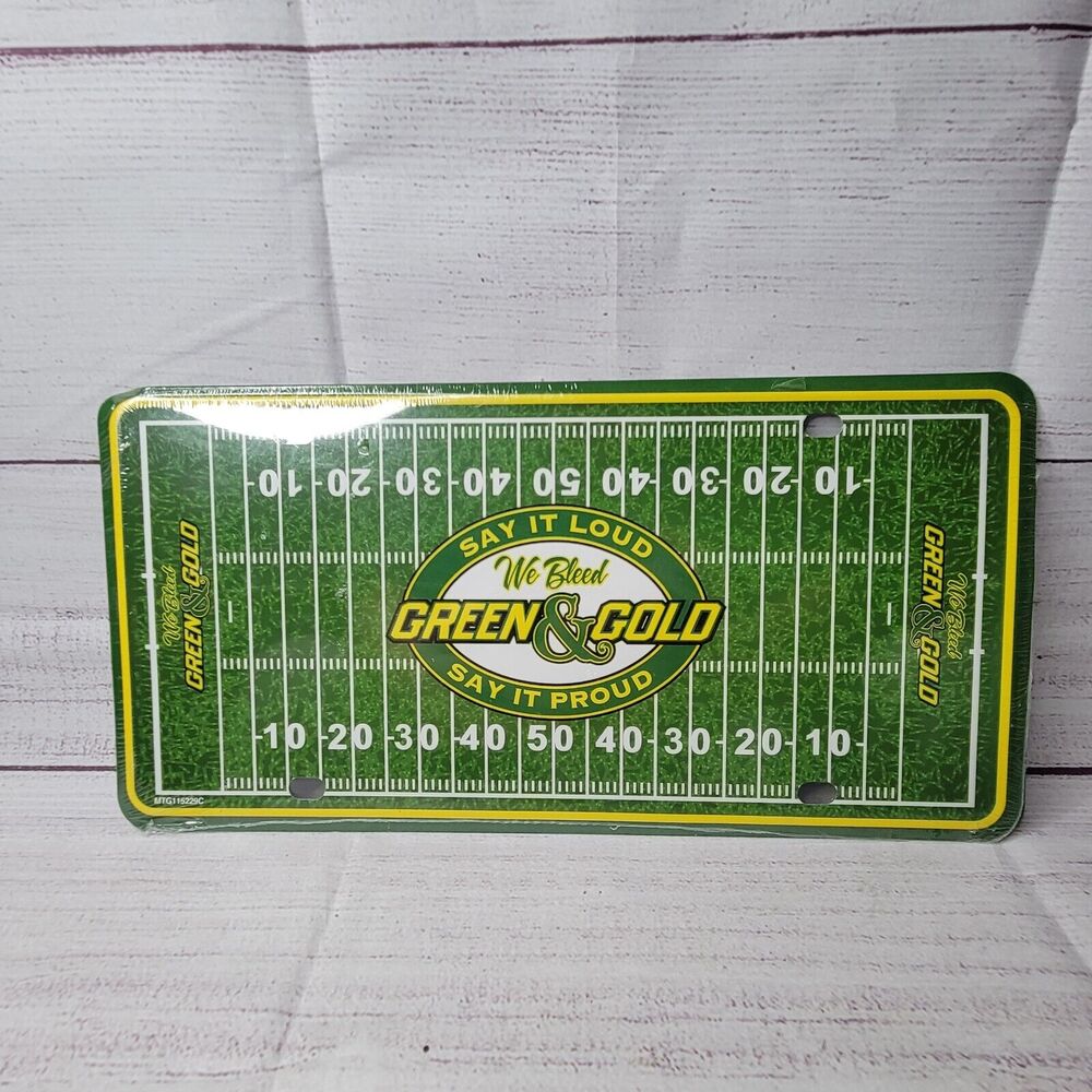 Green Bay packers license plate (we bleed Green & Gold) steel cover factory seal